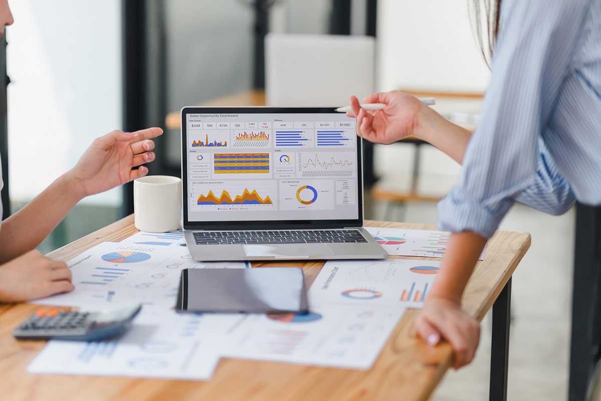 a team looking at metrics on a computer